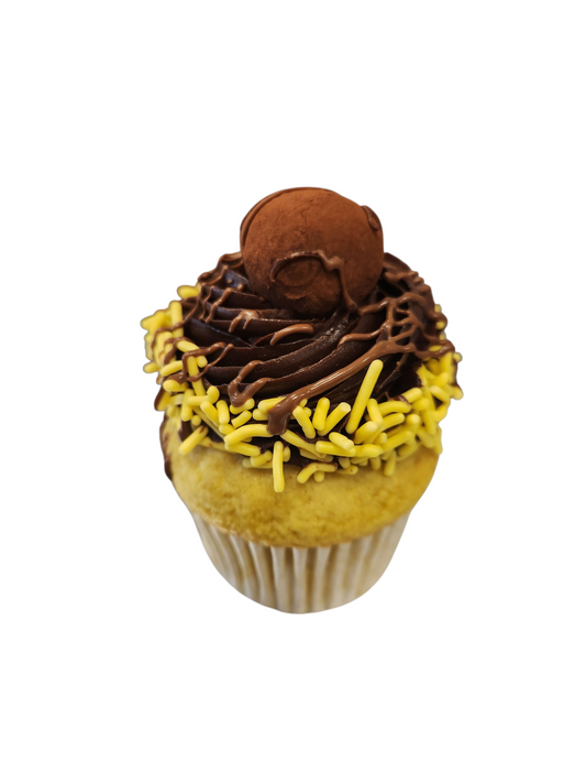 Cupcake with chocolate frosting and yellow sprinkles made fresh daily in Phoenix, AZ.