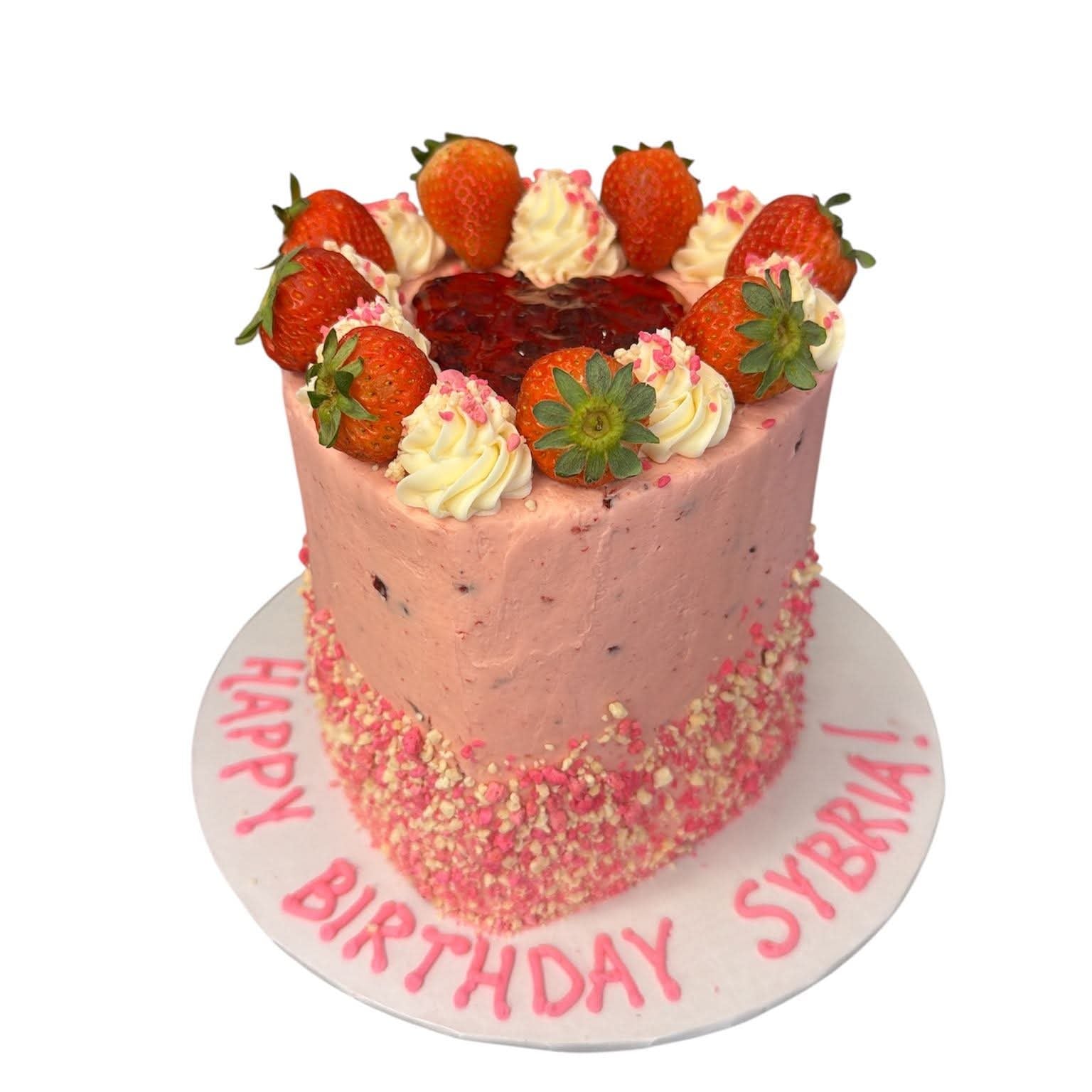 heart shaped birthday cake with fruit on top in Phoenix, AZ.