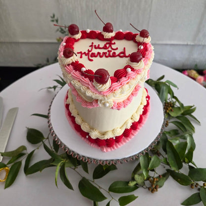 vintage heart shaped wedding cake with cherries in Phoenix.