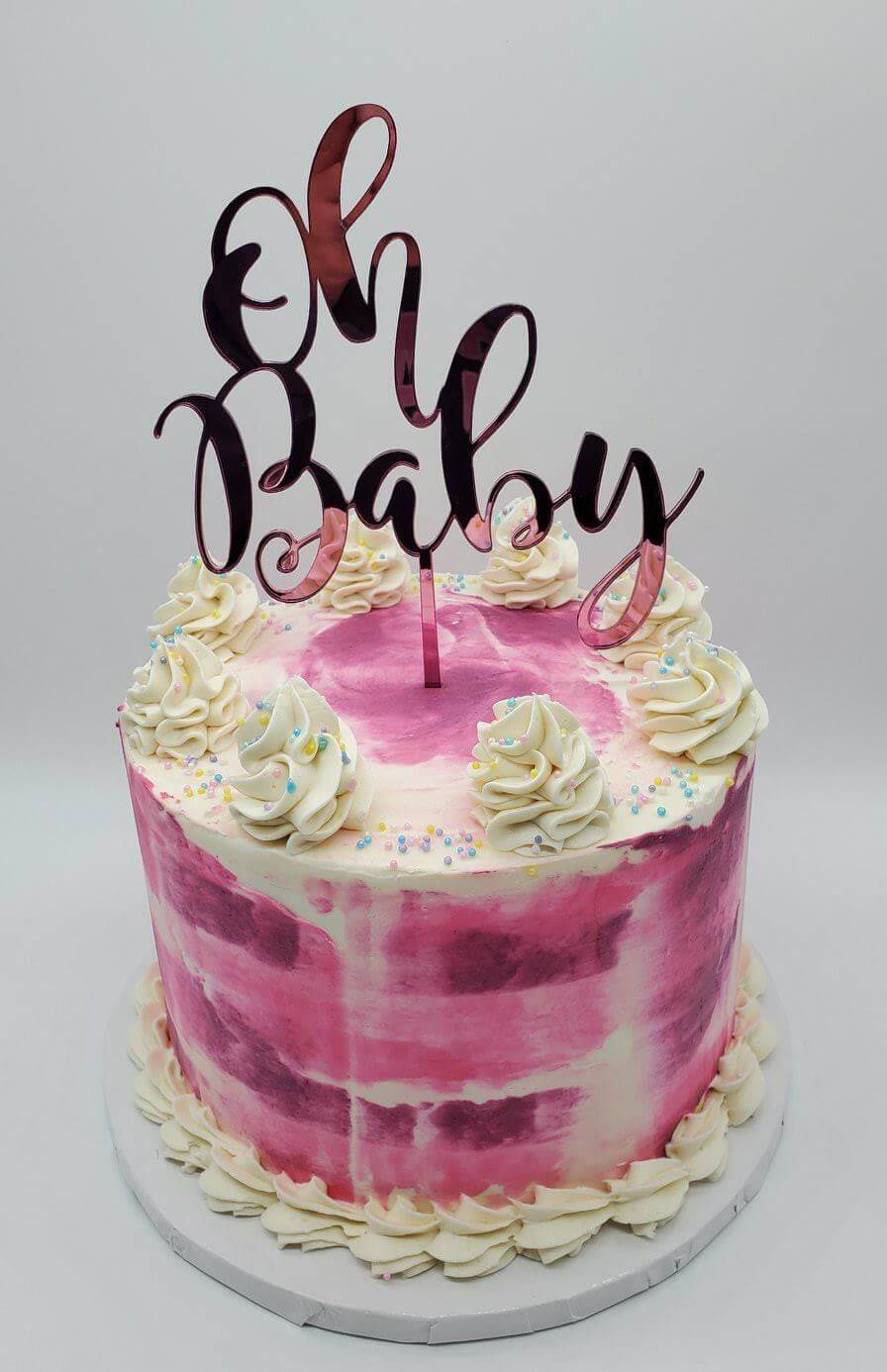 pink oh baby baby shower cake topper on girl cake.