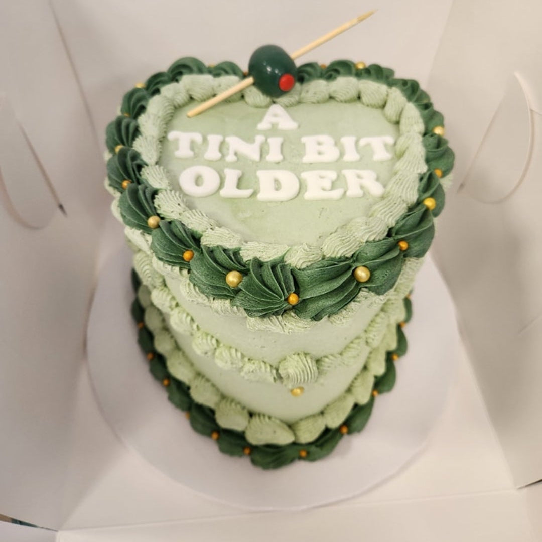 vintage heart shaped cake with green frosting in Phoenix.
