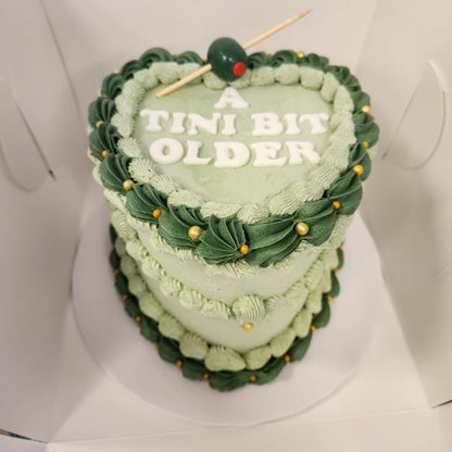 vintage heart shaped cake with green frosting in Phoenix.
