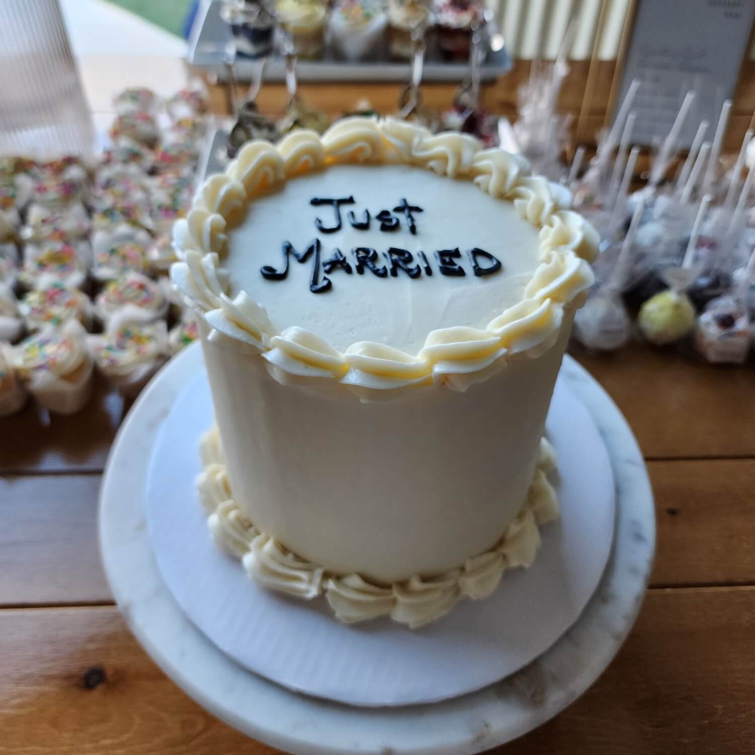 round vintage cake with just married on top in Phoenix.