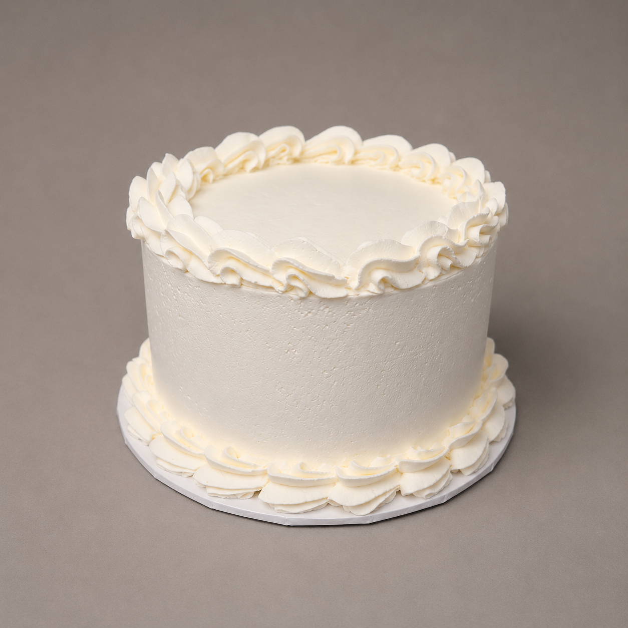 whipped frosting cake with piped borders silver rose bakery