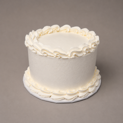 whipped frosting cake with piped borders silver rose bakery